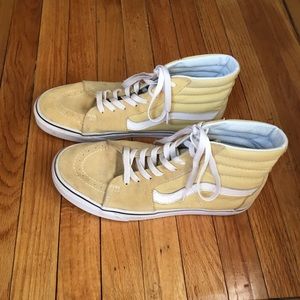 Pale yellow Van’s high tops